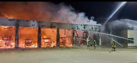 Flames shoot out of the tool shed