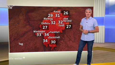 Auf einer Wetterkarte, die rot gefärbt ist, stehen die Temperaturen: bis 34 Grad.