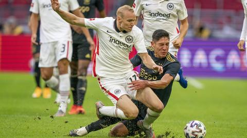 Sebastian Rode in duel with Edson Alvarez of Ajax Amsterdam